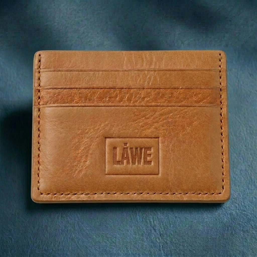 Light brown leather cardholder with 'LÅWE' branding on a blue background