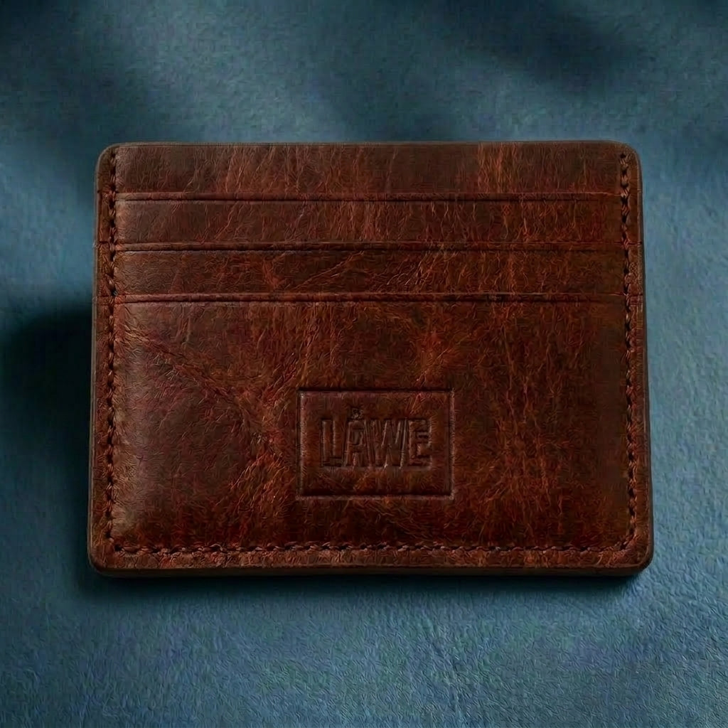 Red toned brown leather card holder with 'LÅWE' branding on a blue background
