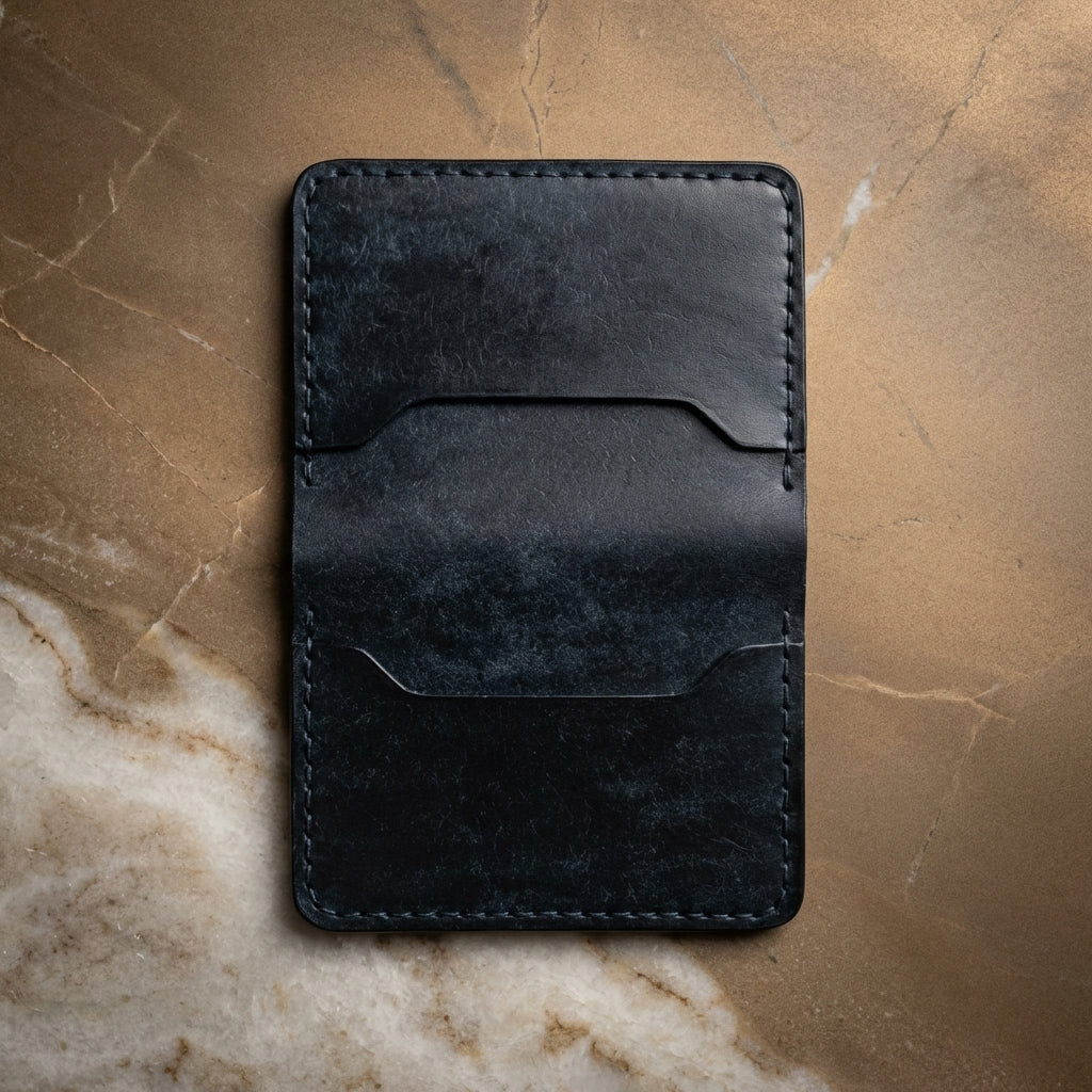 LÅWE Slate Edge - dark blue leather wallet on bronze stone